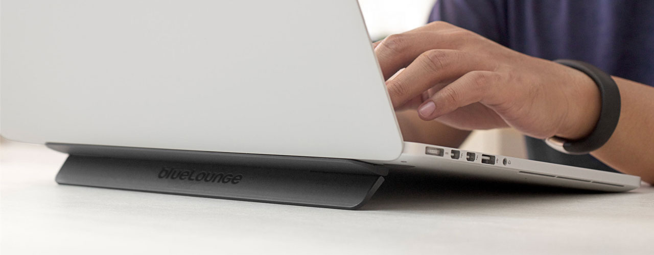 The bluelounge kickflip, a black laptop stand that changed the angle in which the users laptop is elevated in the back.