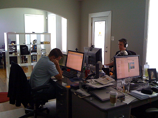 The Pump Studios' second office location. Peter Kaltenbach and Brad Collins are sitting at desks that face each other.