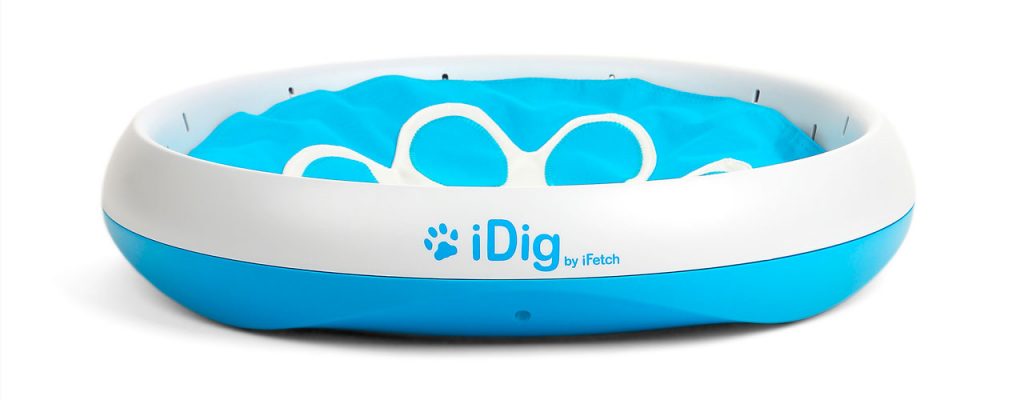 The iFetch's iDig, a plastic toy with blue material flaps that a dog could dig.