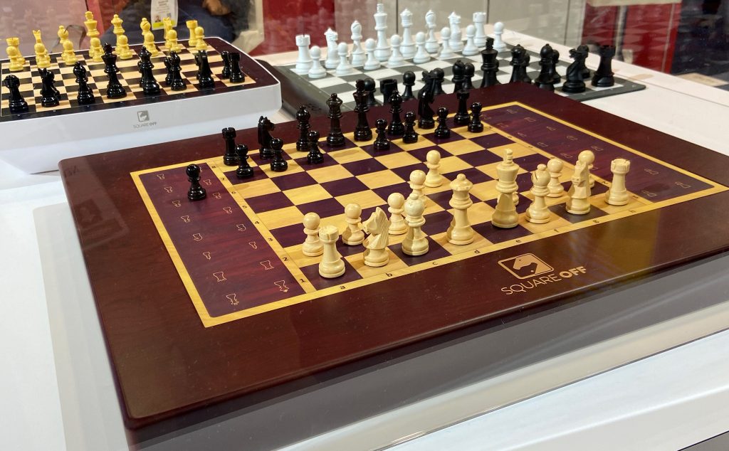 Square Off's Grand Kingdom Set chessboard with moving pieces.