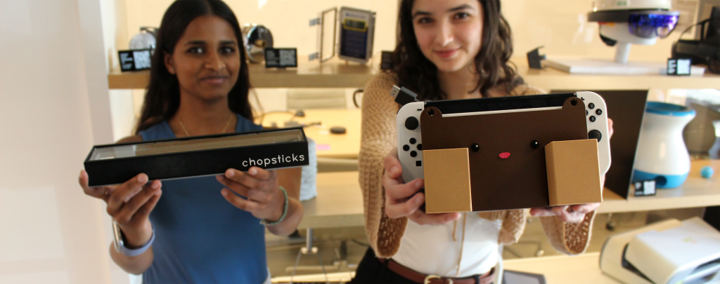 Amrutha and Valeria holding their 3D printed tool boxes.