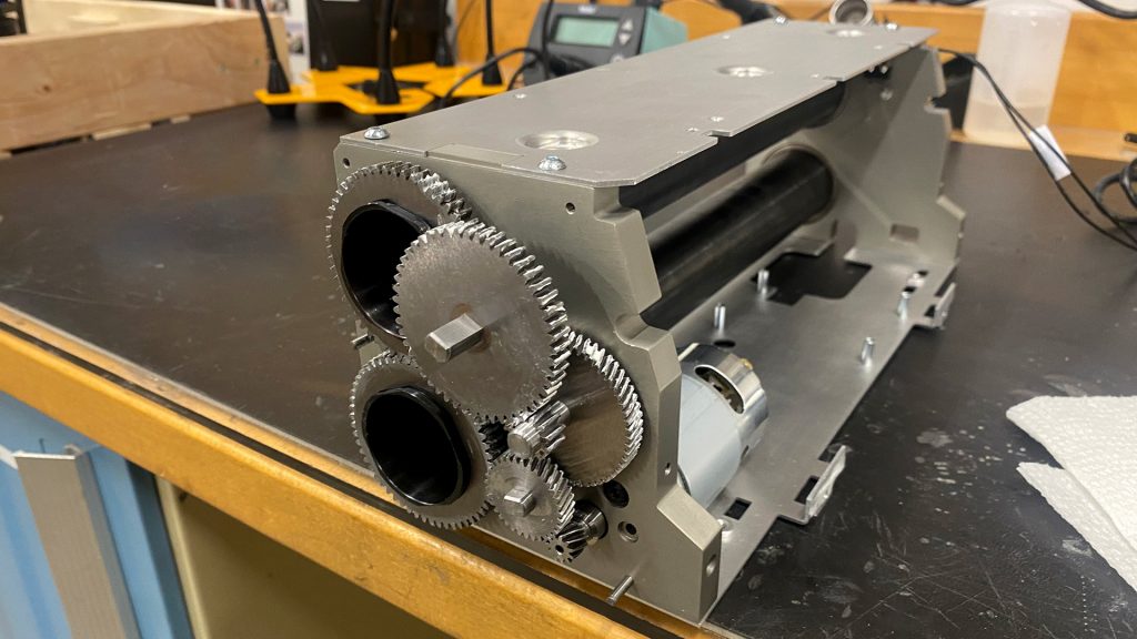 A photo of the Accuquilt gear train at an angle.