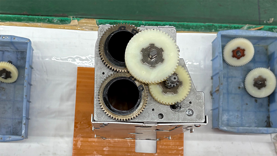 The gear train being assembled in a factory.
