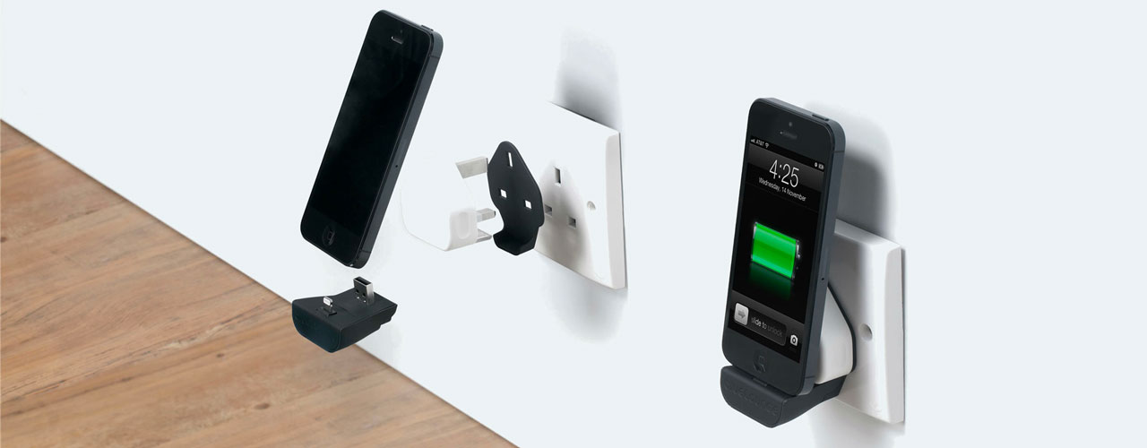 A rendering of the bluelounge minidock attached to a type G plug and iPhone 4.