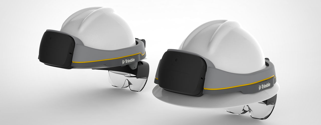 Two renderings of the backs of two white hard hats with the Trimble XR10 on them.