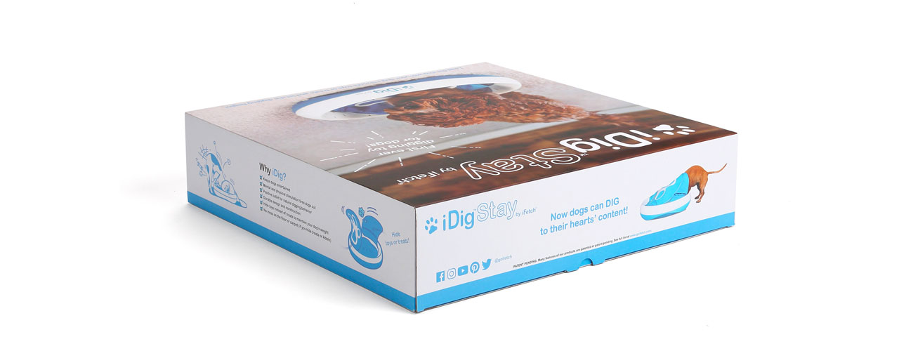 The iFetch's iDigStay box with illustrations and images of dogs digging on the iDig.